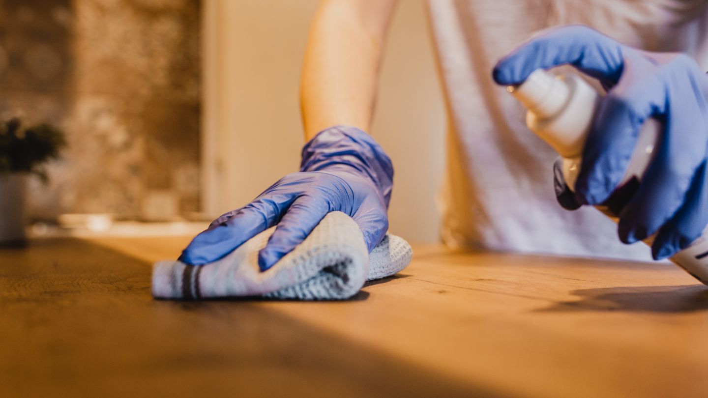 Professional hands-on cleaning for move-in/out service with protective gloves